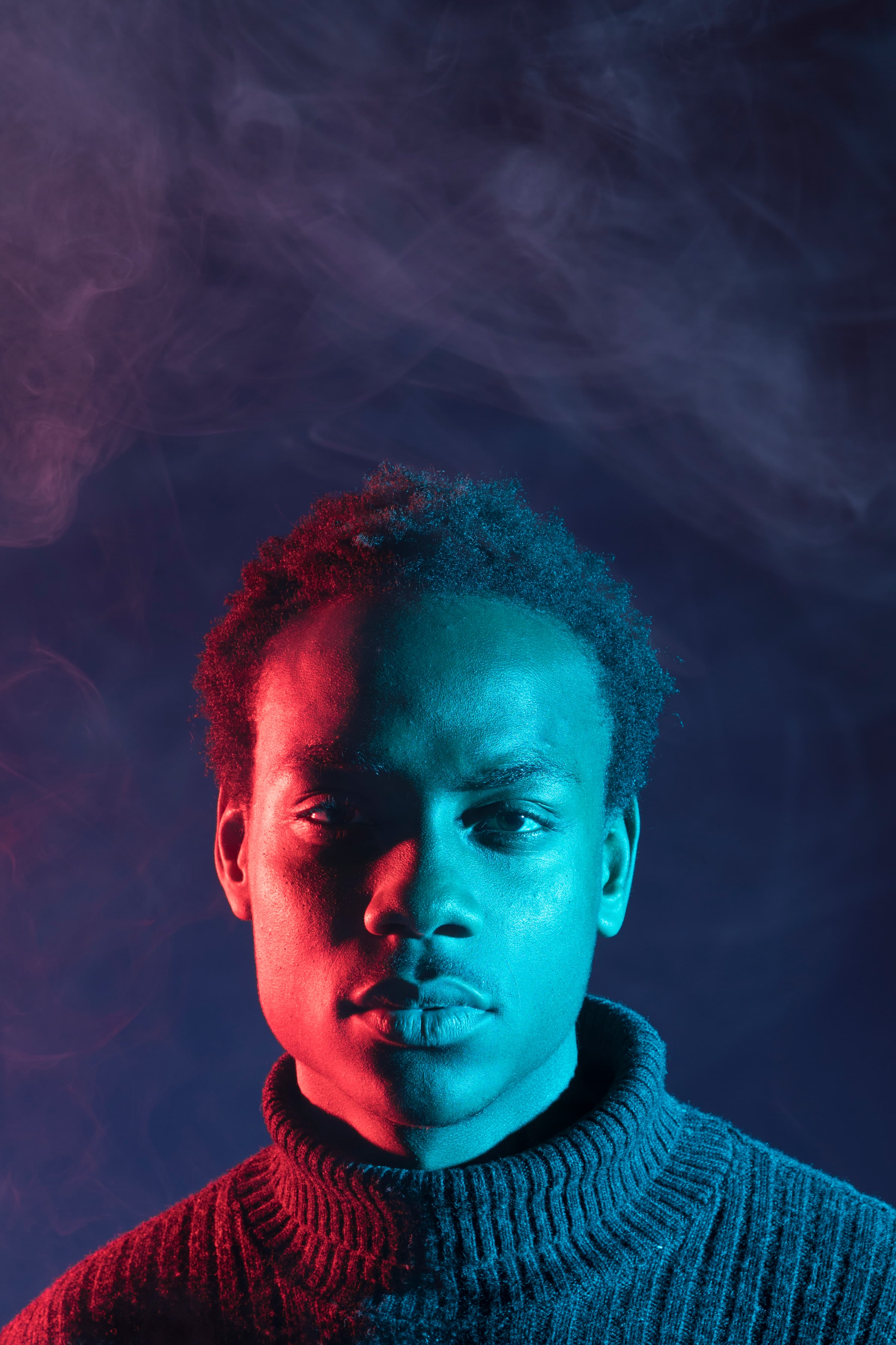 Wide shot of a lively event with colorful lights